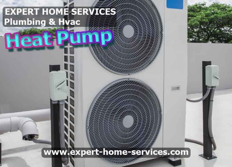 Heat pump system installed outside a house - Efficient Heating & Cooling with Heat Pump Service